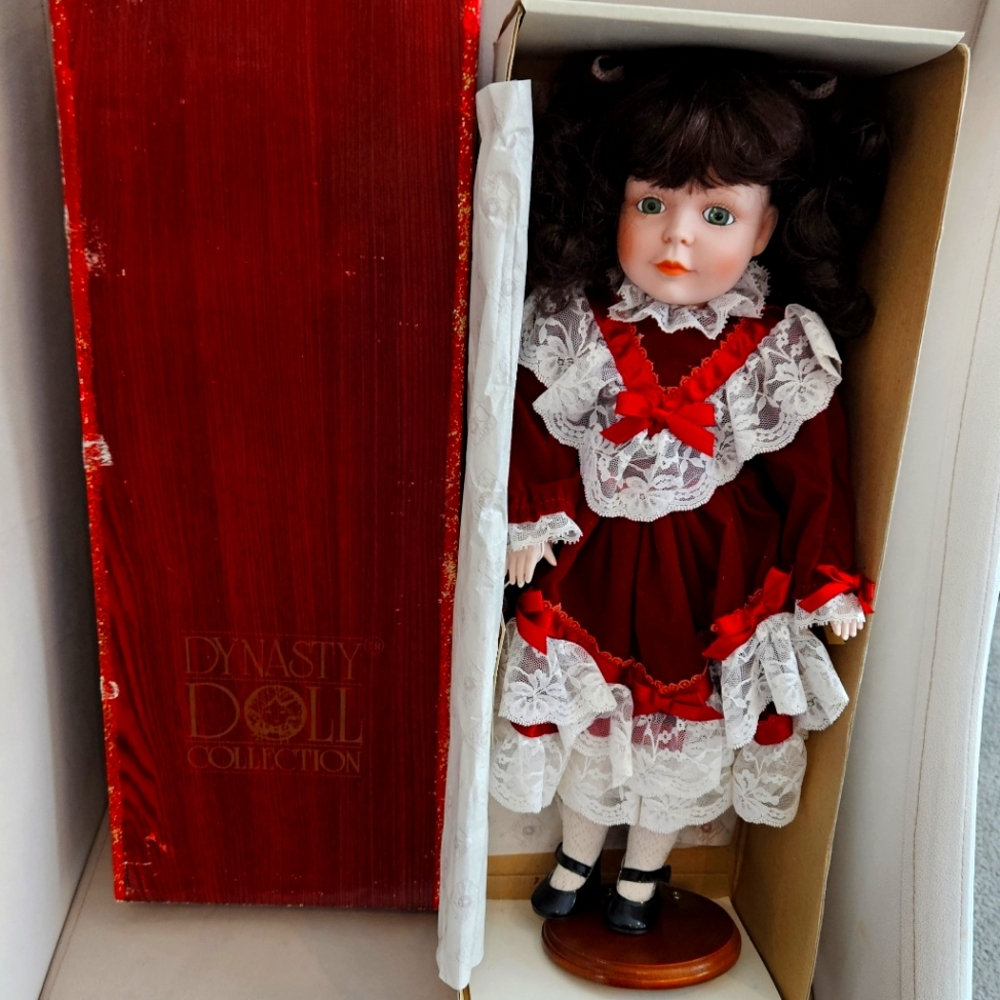 Genuine Dynasty Doll Collection. 18" Porcelain Doll. Velvet Dress and Bow.